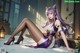A woman with long purple hair sitting on the ground.